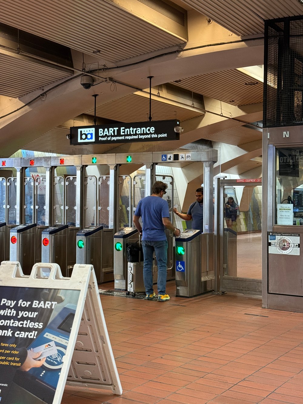 BART Entrance sign above the fare gates — no elevator or escalator status anywhere at the entry point