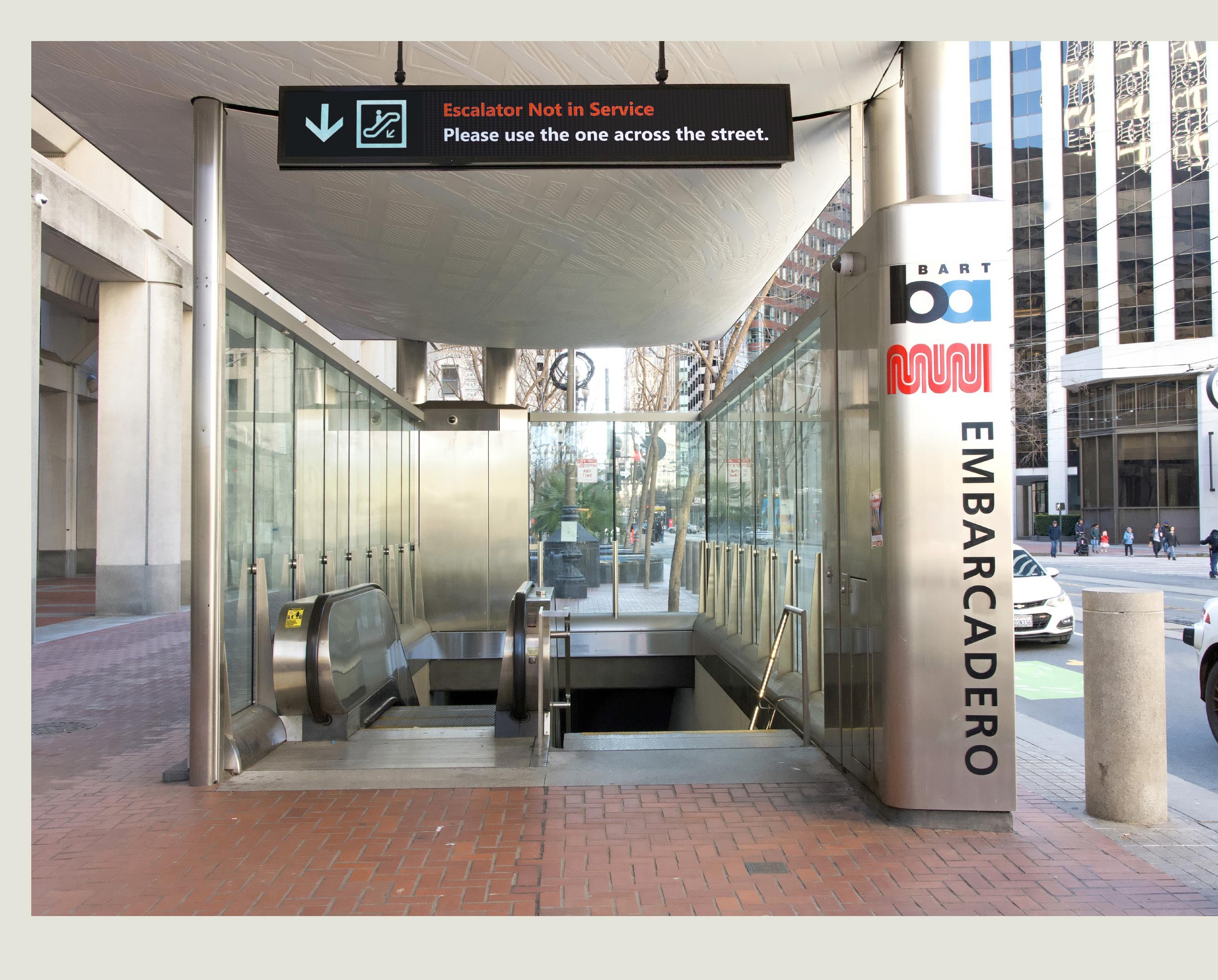 Detail of redesigned overhead signage — Escalator Not in Service, please use the one across the street